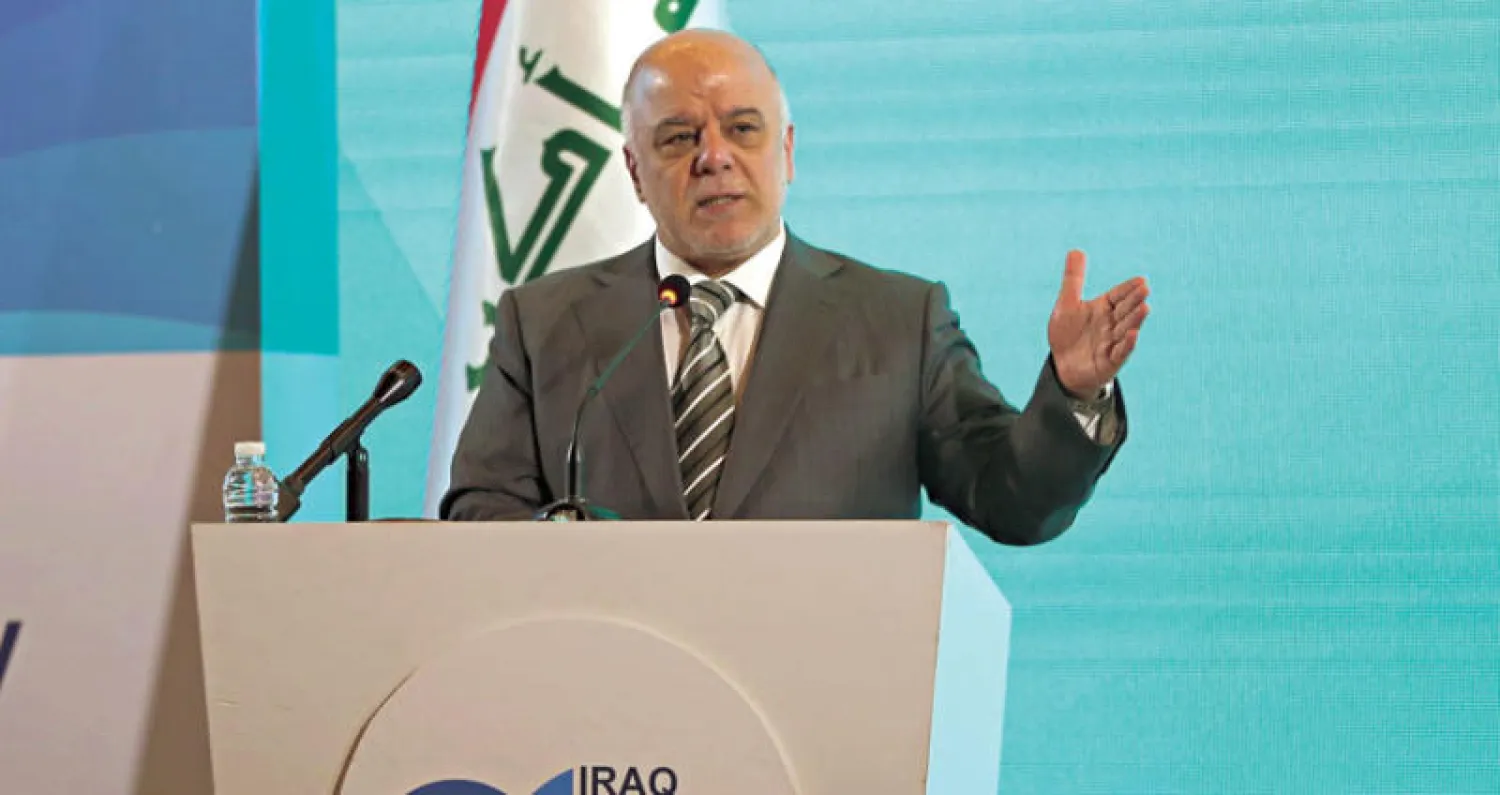 حيدر العبادي خلال مخاطبته «منتدى الطاقة 2018» في بغداد أمس (أ.ب)