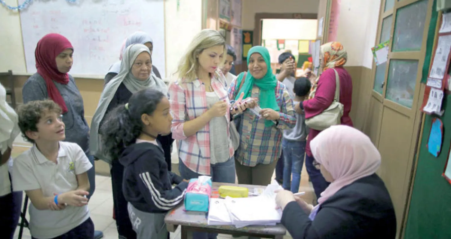 ناخبات في أحد مراكز الاقتراع أمس (إ.ب.أ)