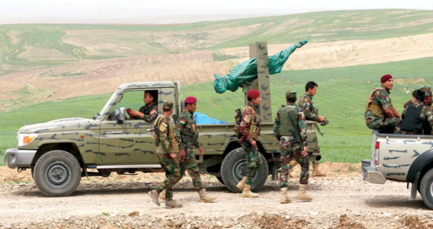 قوات كردية سورية دربتها البيشمركة في منطقة فيشخابور على المثلث الحدودي  العراقي - التركي - السوري أول من أمس (أ.ف.ب)