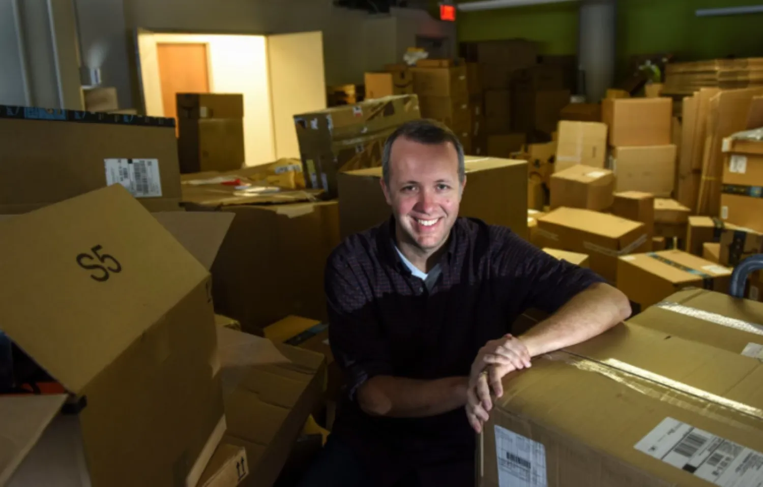 Ethan McAfee, founder and sole owner of Amify, at the company's offices in Alexandria. (Michael Robinson Chavez/The Washington Post)
