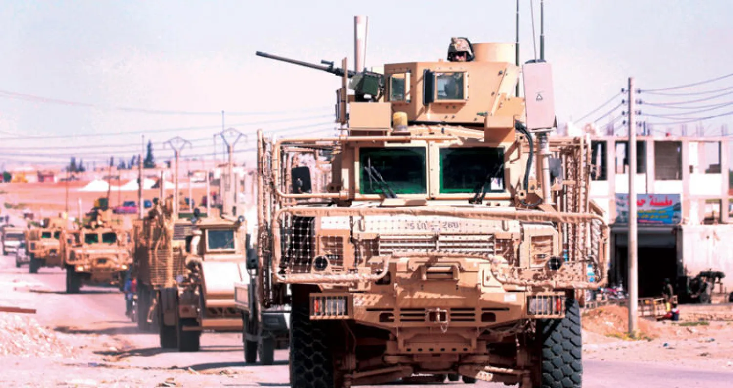 دورية عسكرية للتحالف الدولي بقيادة الولايات المتحدة في منبج شمال سوريا أمس (أ.ف.ب)