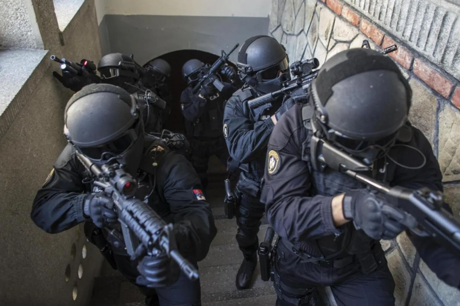 Serbian police officers of the Special Anti-Terrorist Unit pose for a picture in their base outside Belgrade October 8, 2014. REUTERS/Marko Djurica
