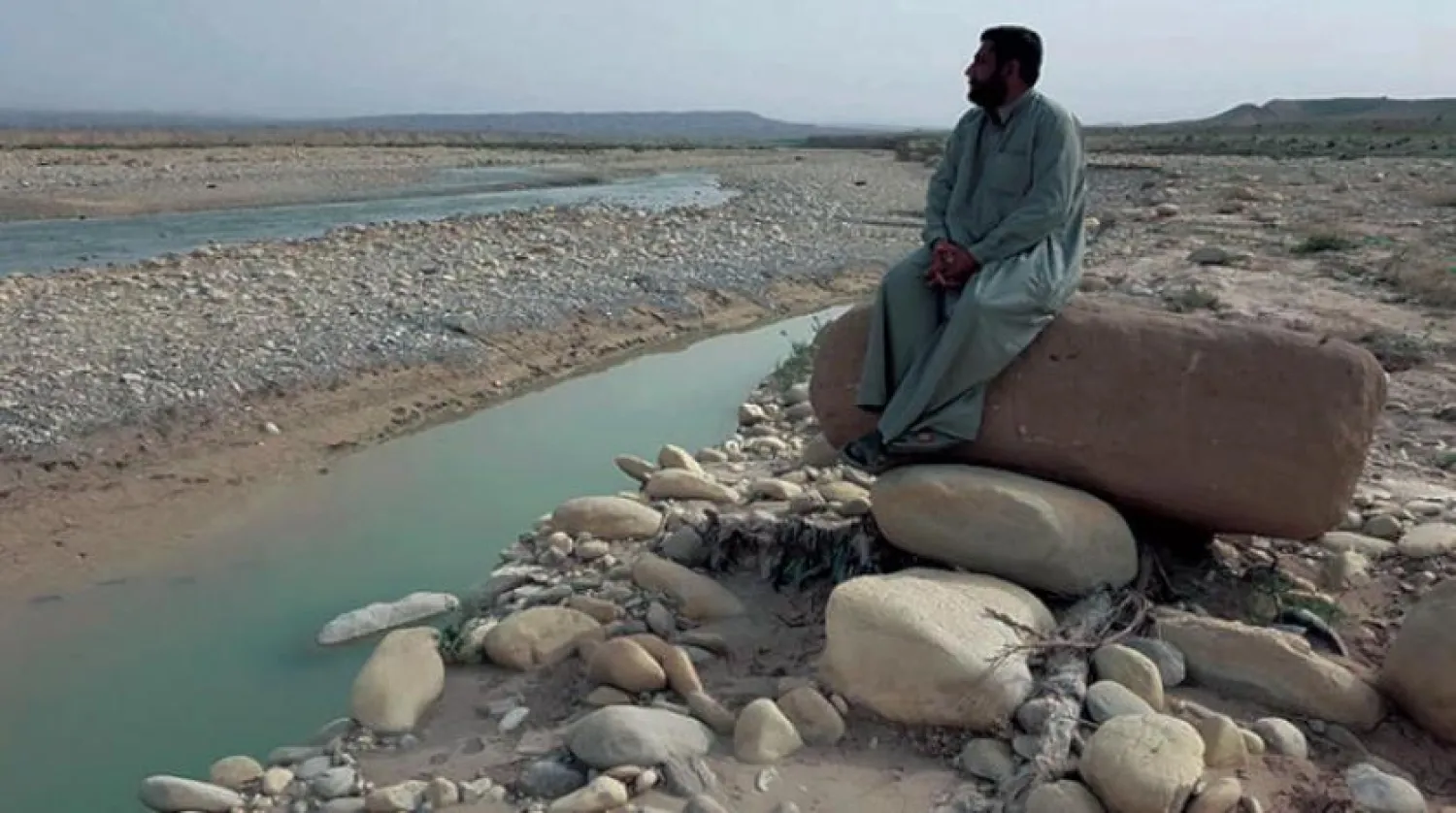  Abu Malak sits on a rock in Wadi Kankir, near the borderline with Iran/Asharq Al-Awsat