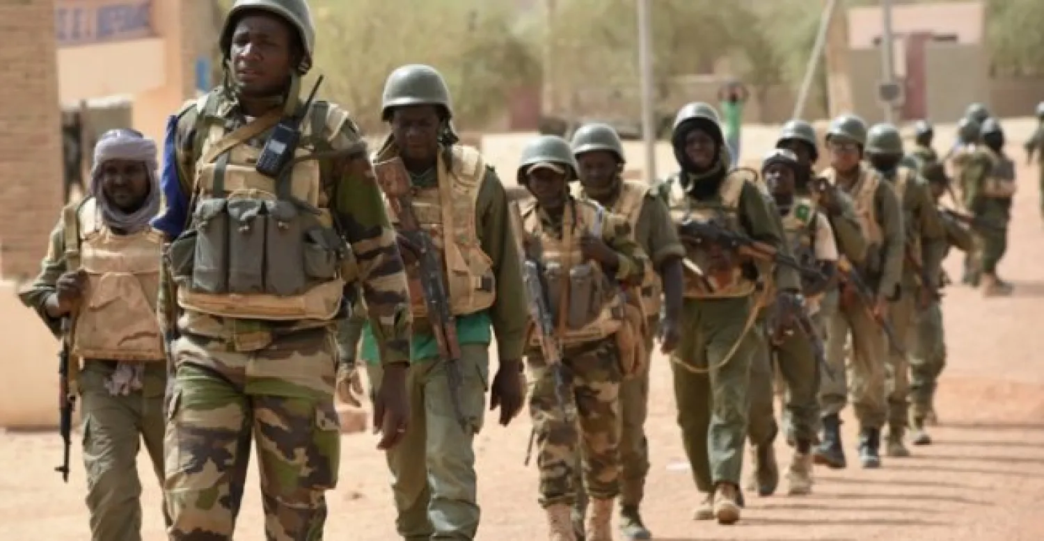 © Philippe Desmazes, AFP | Malian soldiers patrol near Timbuktu on June 3, 2015.
