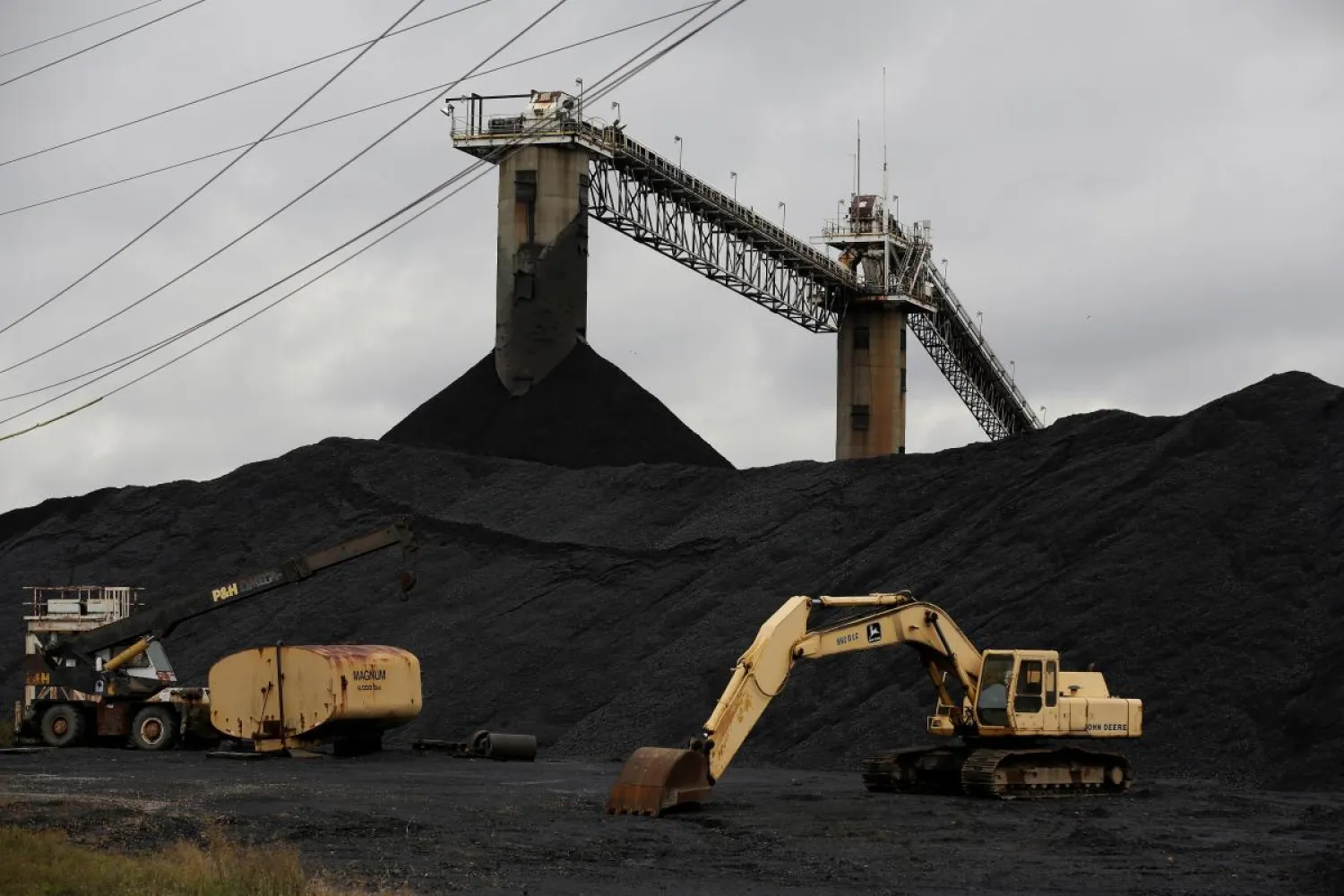 Earth moving equipment sits by a coal pile at the Century Mine in Beallsville, Ohio, US, November 7, 2017. REUTERS/Joshua Roberts 