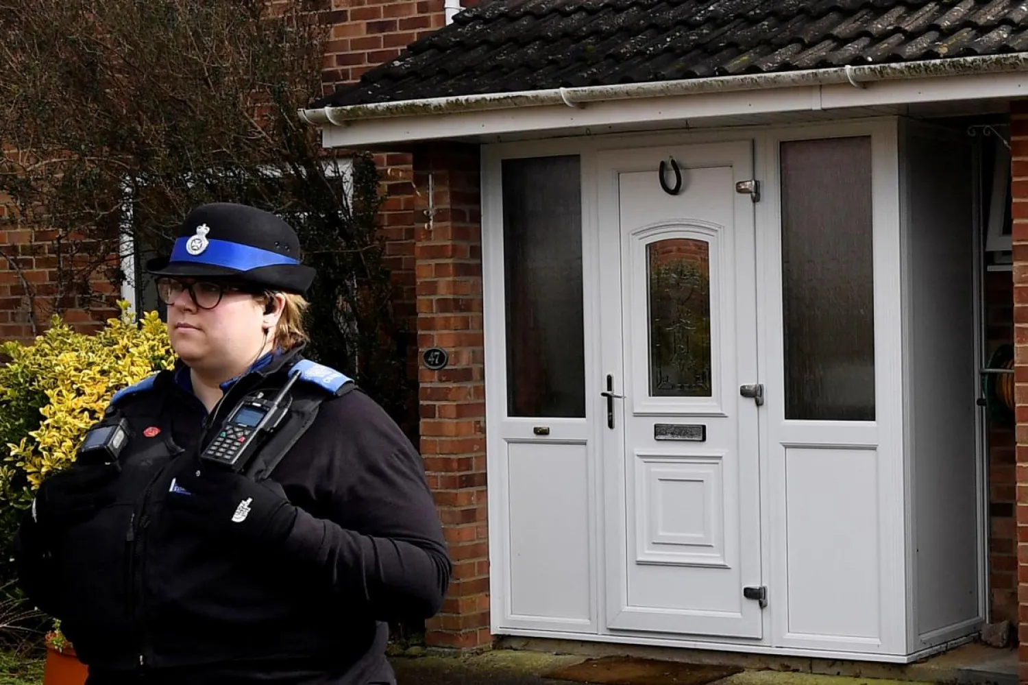 A police officer stands guard outside of the home of former Russian military intelligence officer Sergei Skripal, in Salisbury, Britain, March 6, 2018. REUTERS/Toby Melville