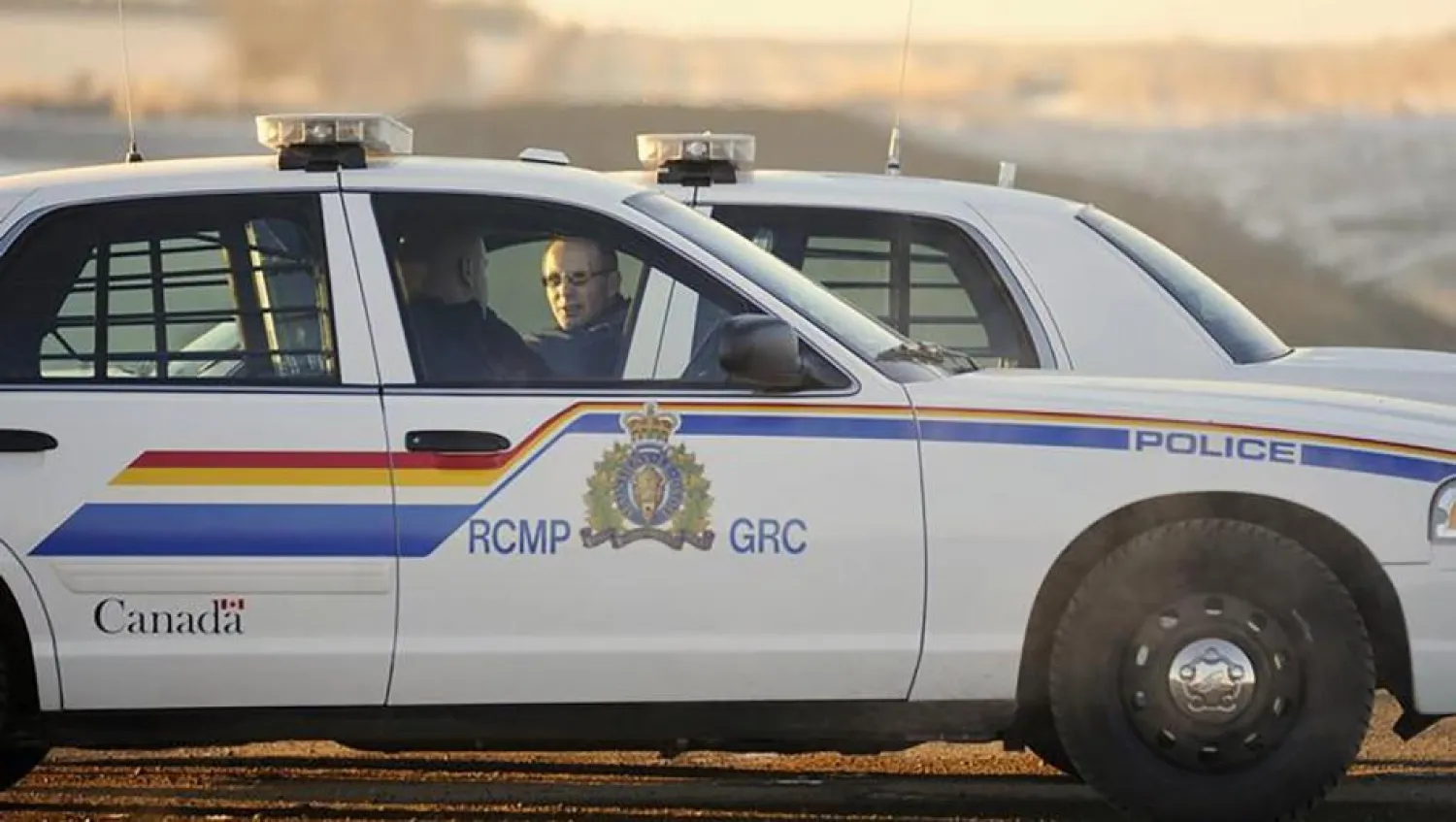 Two Royal Canadian Mounted Police (RCMP) officers talk at a blockade in Alberta. Reuters file photo