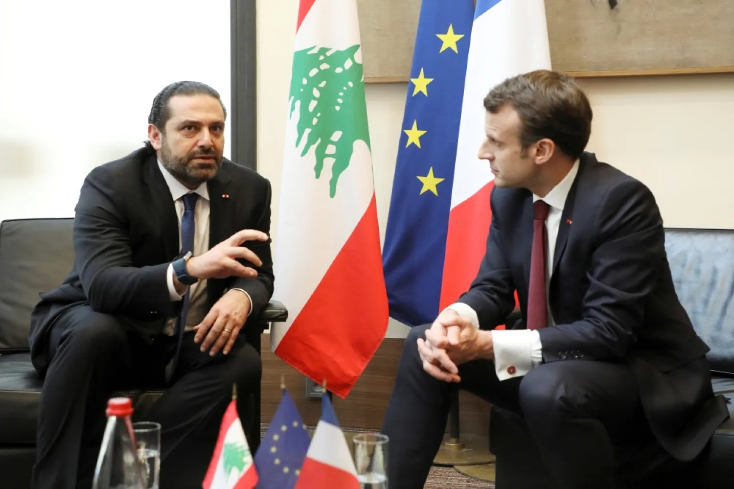 Lebanese Prime Minister Saad Hariri, left, speaks with French President Emmanuel Macron as they attend the Cedar (CEDRE) Conference for international donors and investors to support Lebanon's economy, in Paris, France, on April 6, 2018. Photo - Reuters