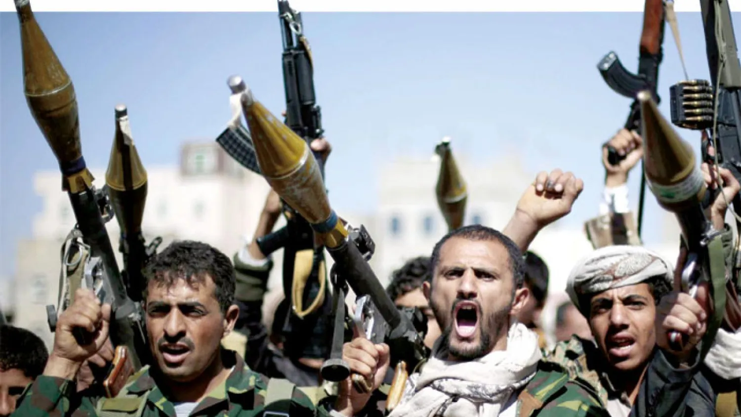 Tribesmen loyal to Houthi rebels hold their weapons in Sana’a. (AFP)
