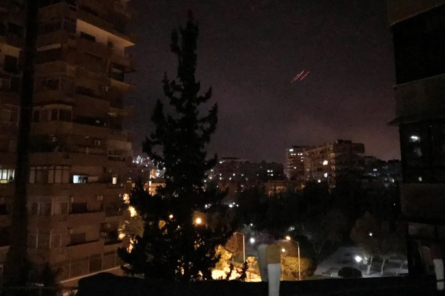 Anti-aircraft fire is seen over Damascus, Syria early April 14, 2018. Feras Makdesi, Reuters