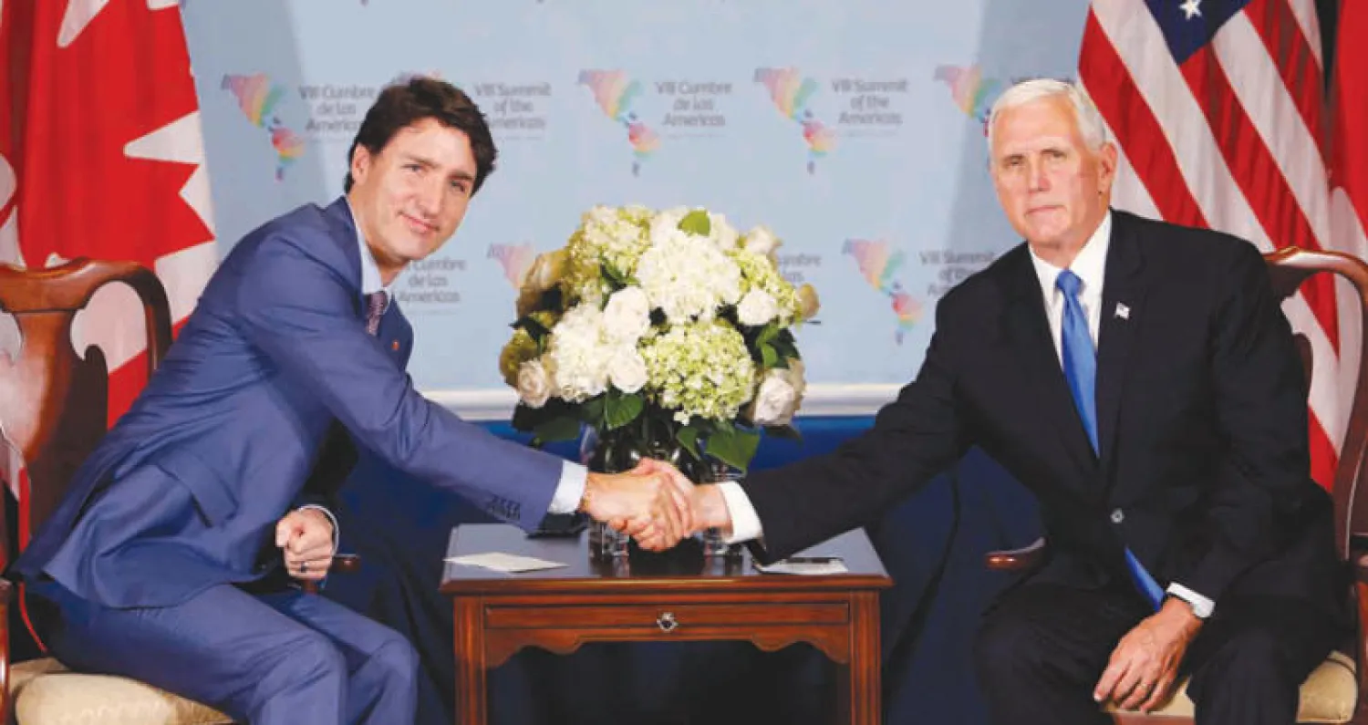 بنس وترودو عقب اجتماع ثنائي على هامش قمة ليما السبت (أ.ب)