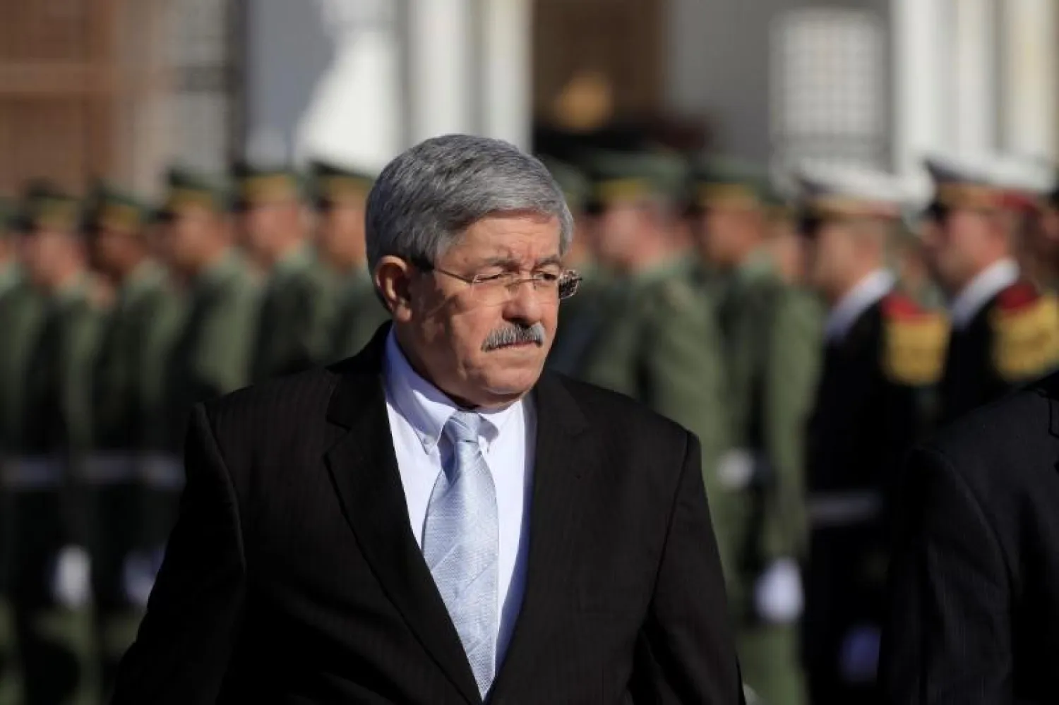 Algerian Prime Minister Ahmed Ouyahia awaits the arrival of French President Emmanuel Macron at Houari Boumediene airport in Algiers, Algeria December 6, 2017. Picture taken December 6, 2017 REUTERS/Zohra Bensemra
