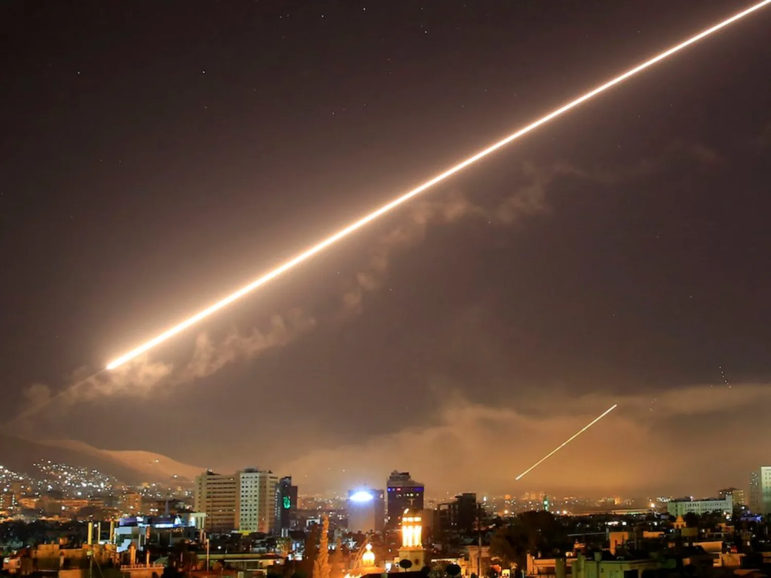 Damascus skies erupt with surface to air missile fire as the US launches an attack on Syria on April 14. (AP)