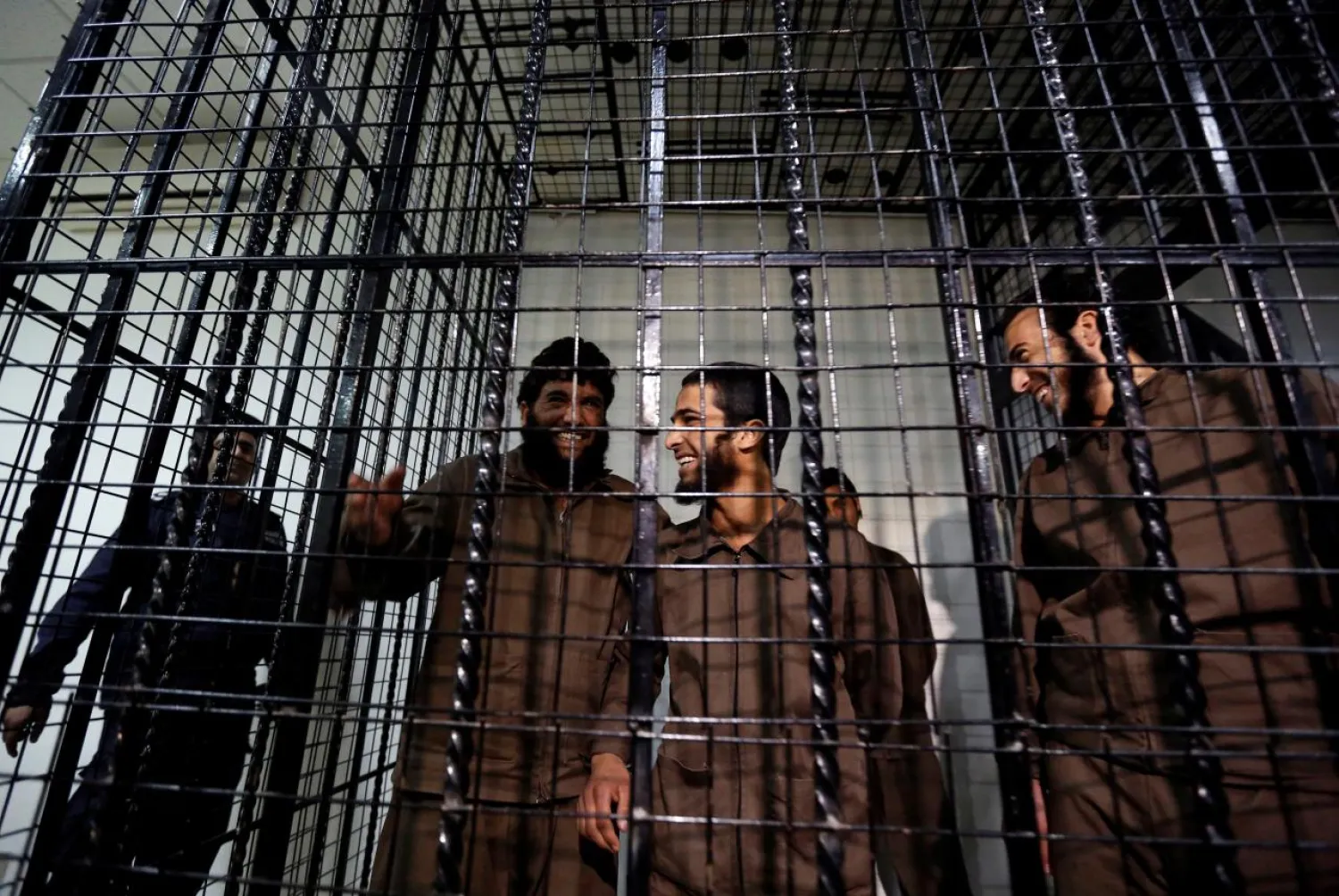 Five Syrians, accused of facilitating the Rukban bombings in June 2016, react during their trial at the State Security Court in Amman, Jordan December 4, 2017. Reuters/Muhammad Hamed
