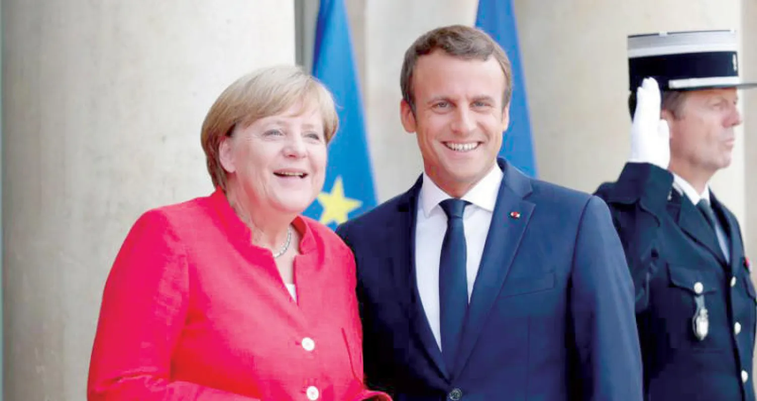 ماكرون سيجري مشاورات مع ميركل في برلين حول إيران قبل لقاء ترمب في واشنطن (رويترز)
