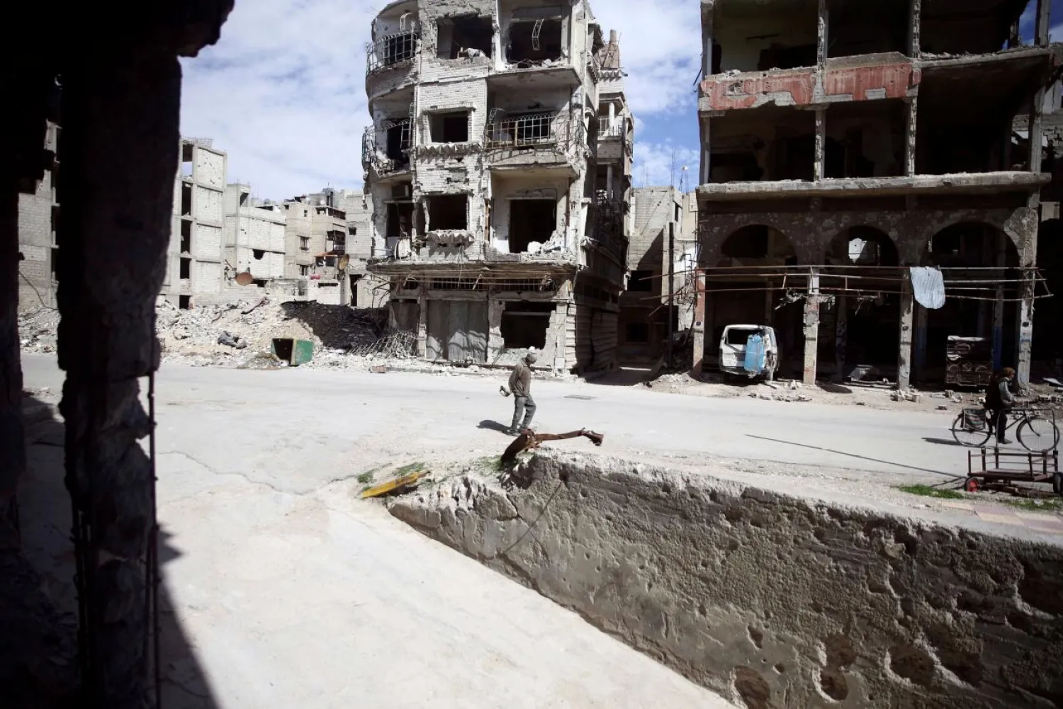 People are seen in the town of Douma, Eastern Ghouta, in Damascus, Syria March 9, 2018. (Reuters)