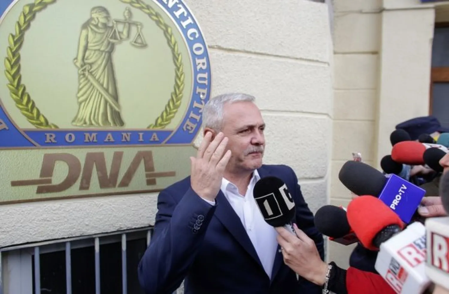 FILE PHOTO: Social Democrat Party leader Liviu Dragnea gestures after leaving the Romanian anti-corruption prosecutors headquarters in Bucharest, Romania, November 13, 2017. Inquam Photos/Octav Ganea/via REUTERS
