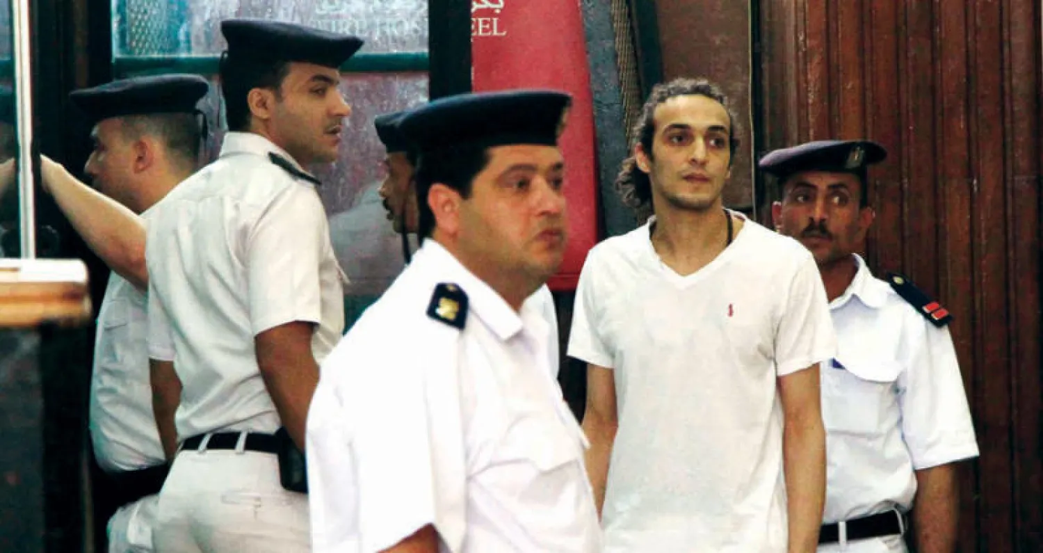 المصور الصحافي المصري محمود أبو زيد {شوكان} في إحدى جلسات محاكمته بالقاهرة (أ.ب)