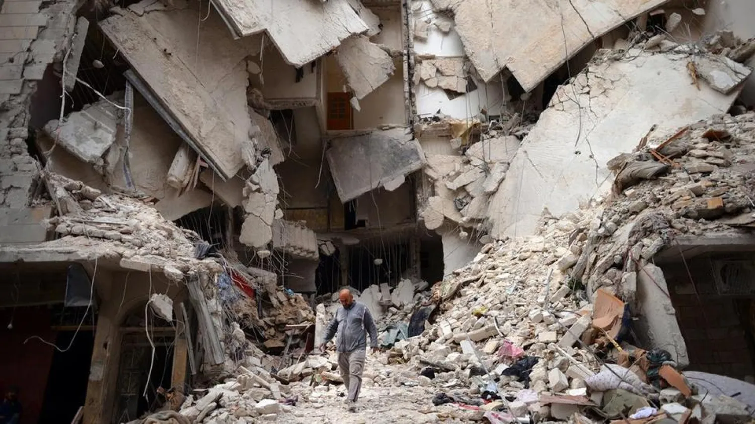 A Syrian man walks amid destruction in the northern Syrian city of Aleppo. (AFP)