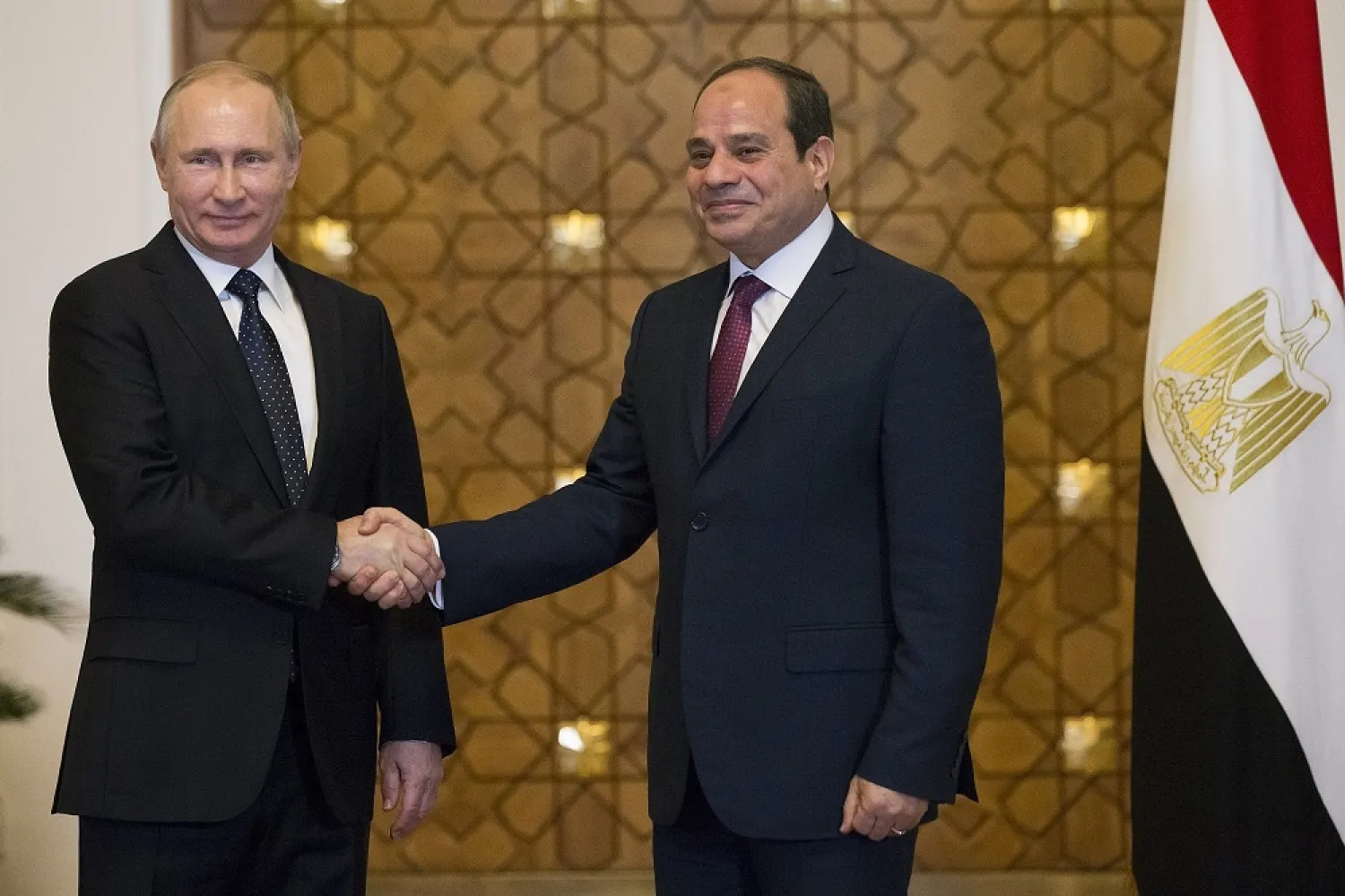 Russian President Vladimir Putin and Egyptian President Abdul Fattah al-Sisi shake hands during their meeting in Cairo, Egypt, December 11, 2017. (AP)