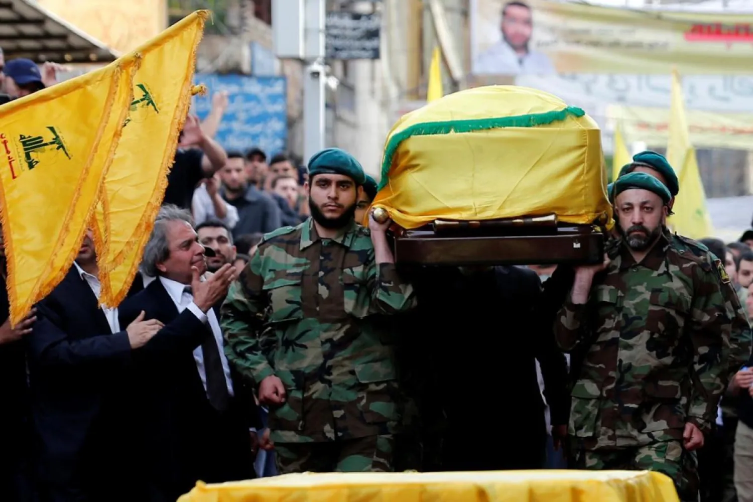 Hezbollah members carry the coffin of top Hezbollah commander Mustafa Badreddine, who was killed in an attack in Syria. Lebanon, May 13, 2016. REUTERS/Jamal Saidi