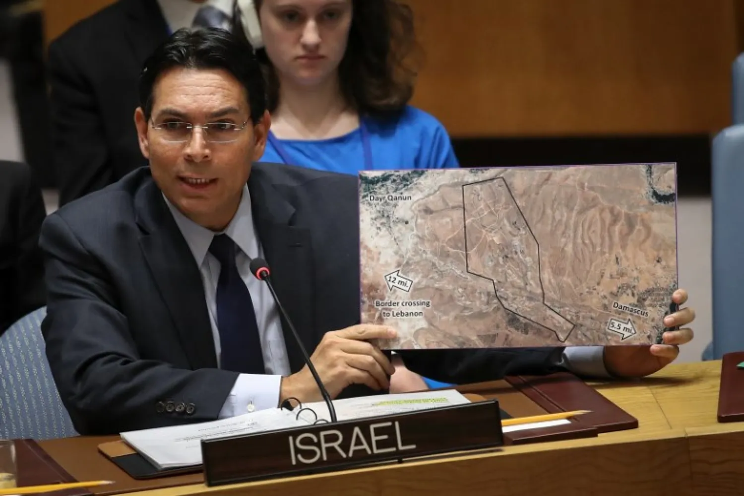 Israeli ambassador to the United Nations Danny Danon holds a map that he claims shows the area in Syria where Iran is recruiting and training upwards of 80,000 Shi'ite fighters at a base five miles from Damascus. Drew Angerer/Getty Images/AFP 
