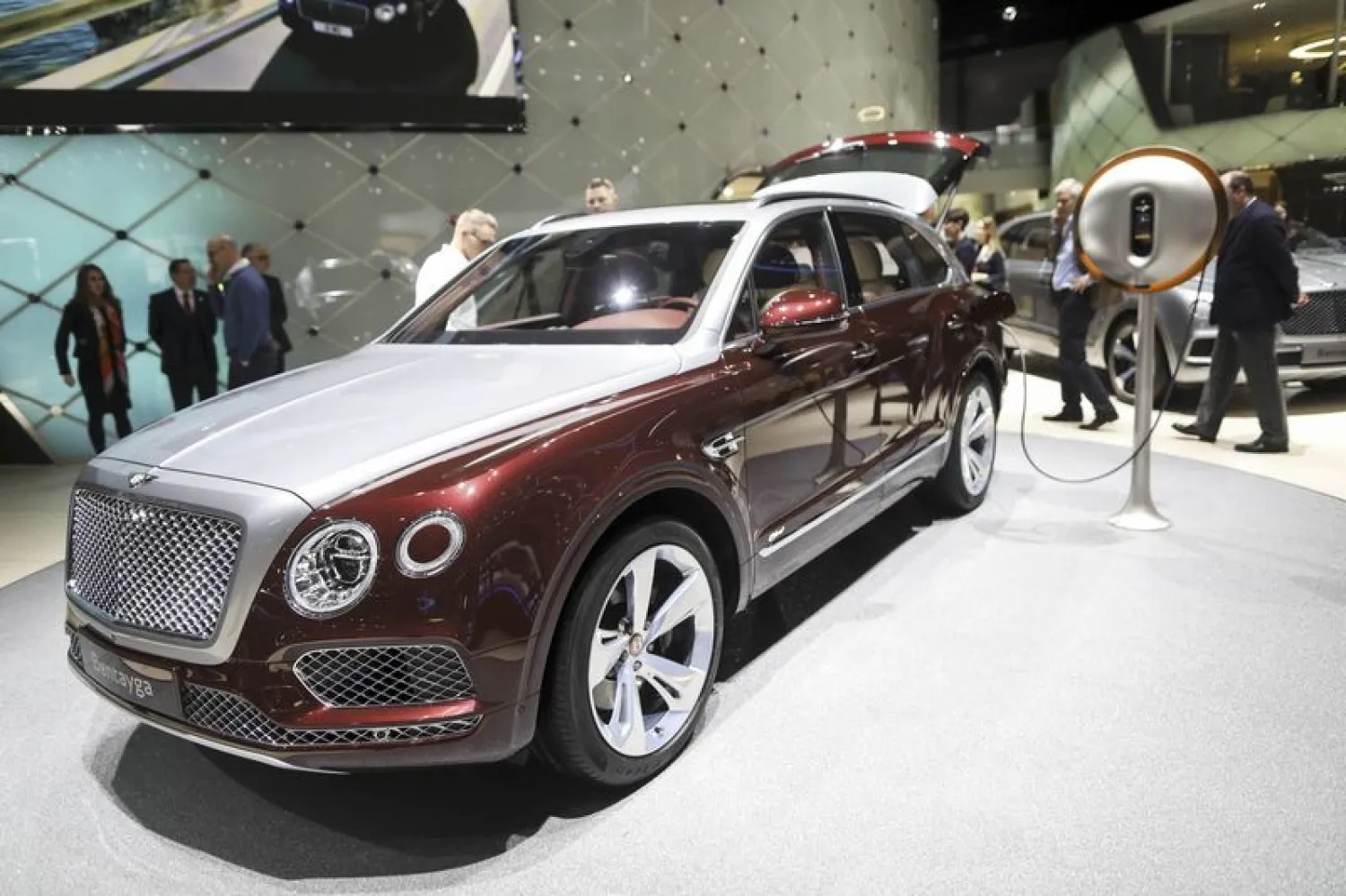 A plug-in power dock made from sustainable materials and designed by French designer Philippe Starck stands next to the 2019 Bentley Bentayga hybrid luxury SUV during the recent Geneva Motor Show. Photographer: Chris Ratcliffe/Bloomberg