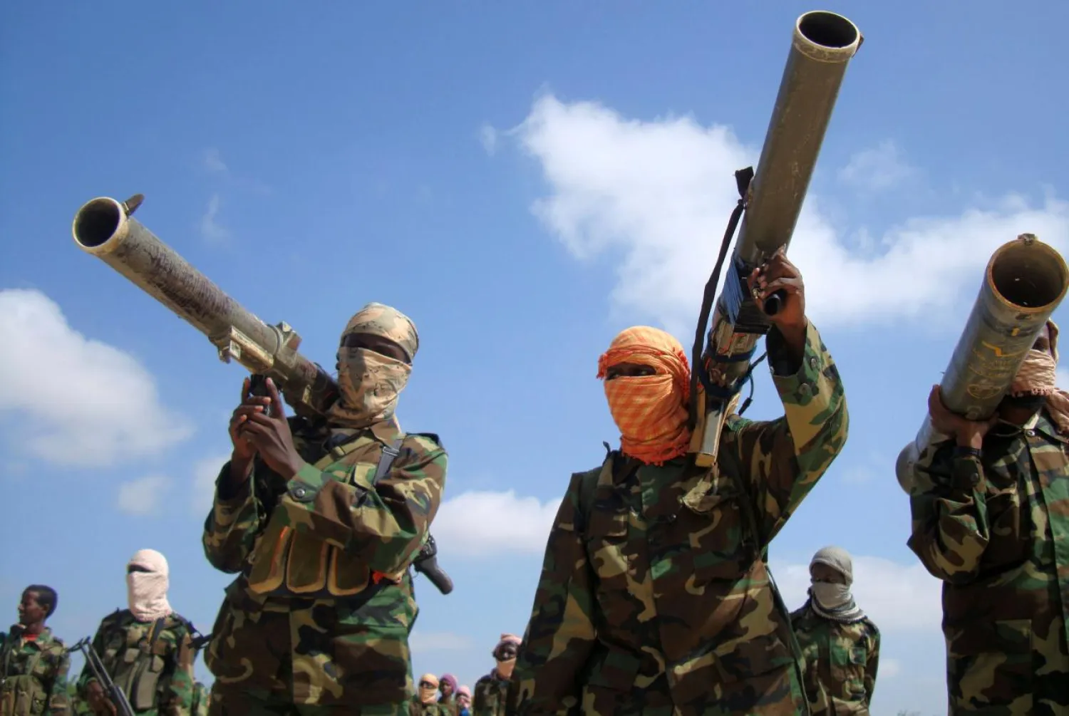 FILE PHOTO: Members of Somalia's al-Qaeda linked Shabaab militia hold their weapons in Mogadishu, Somalia January 1, 2010. REUTERS/Feisal Omar/File Photo