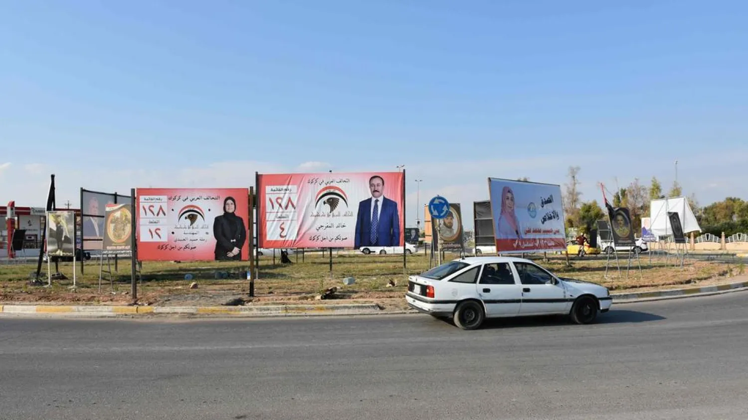 A picture taken on April 14, 2018 in the Iraqi city of Kirkuk shows campaign billboards for candidates in the upcoming parliamentary elections. (AFP)