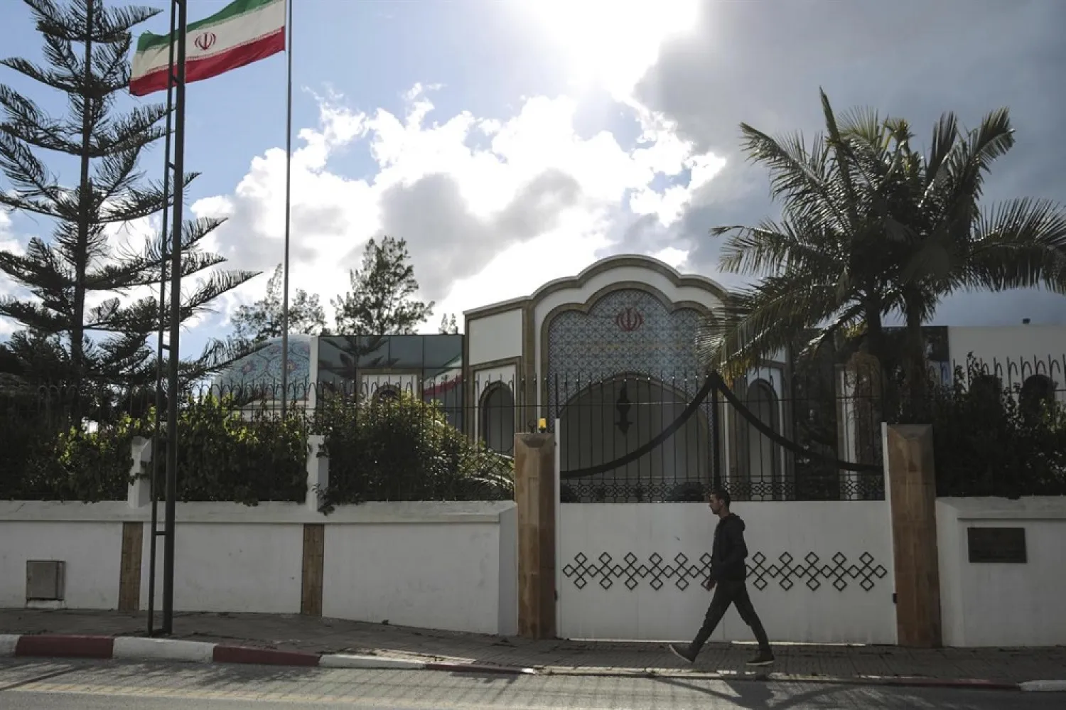 A man walks past the embassy of Iran in Rabat, Morocco, Tuesday, May 1, 2018. (AP)