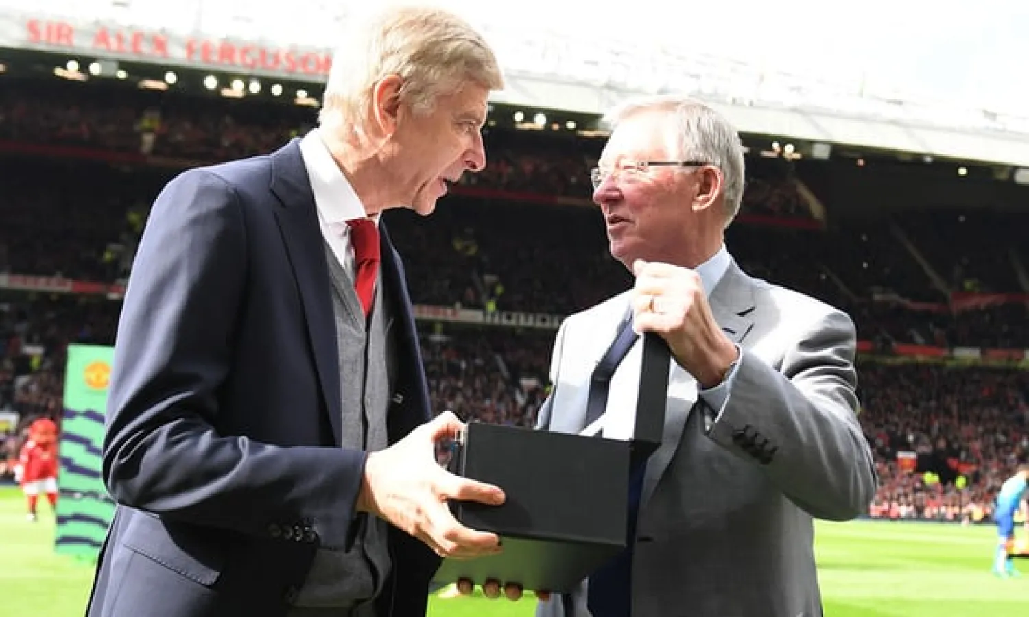  Former Manchester United manager Sir Alex Ferguson presented Arsène Wenger with a gift to mark his Arsenal retirement. Photograph: Stuart MacFarlane/Arsenal FC via Getty Images
