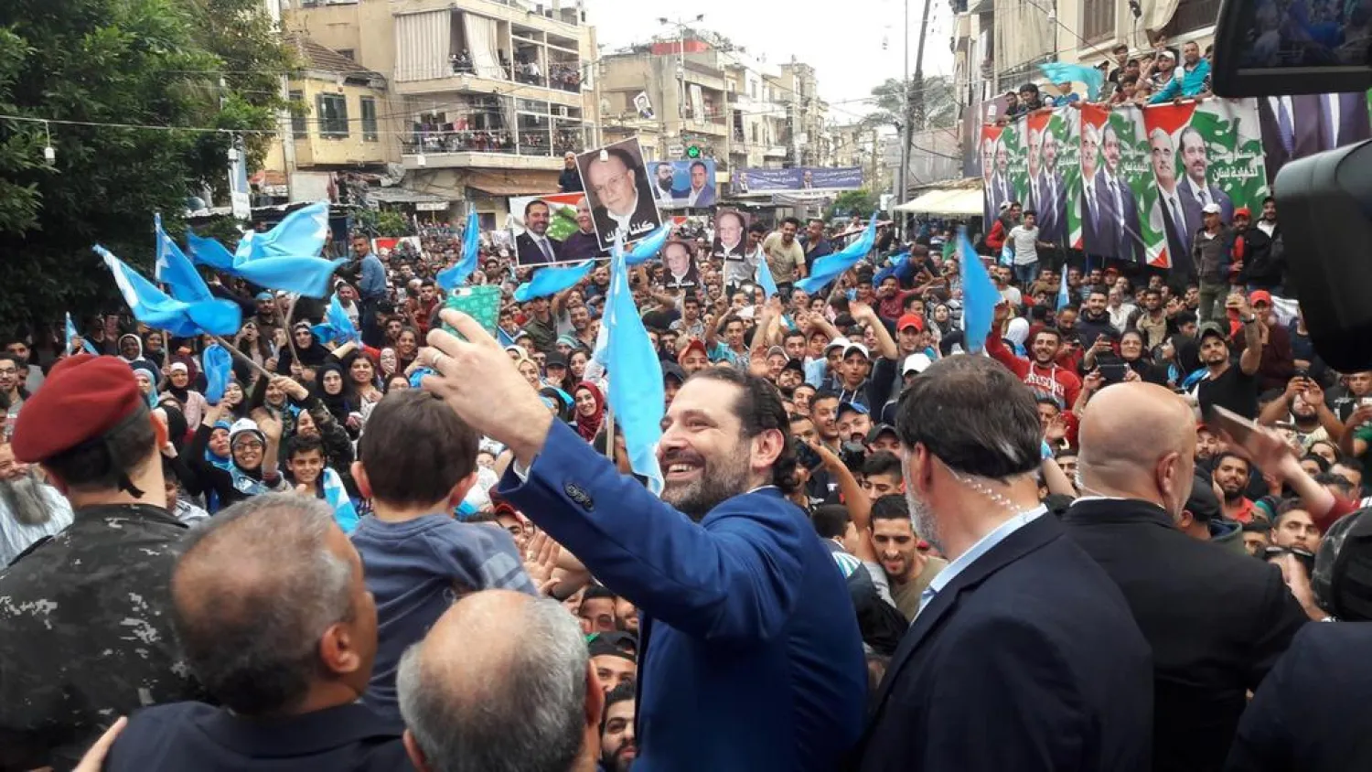 Lebanon's Prime Minister Saad al Hariri takes selfies during an election campaign in Tripoli. (Dalati & Nohra)
