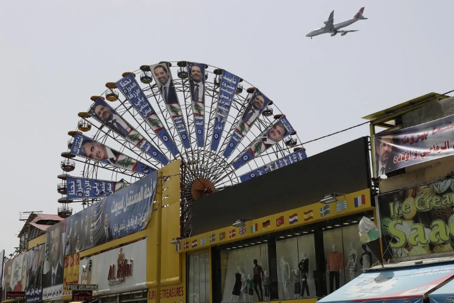 A great wheel in the Lebanese capital Beirut carries electoral billboards of Lebanese Prime Minister and candidate for the upcoming parliamentary elections Saad Hariri on May 2, 2018. JOSEPH EID / AFP