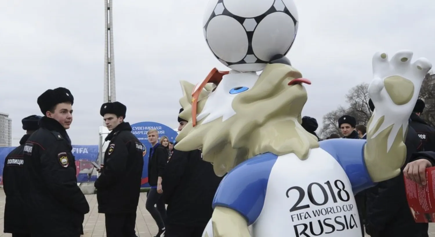 Police officers walk past the official mascot for the 2018 FIFA World Cup Russia, Zabivaka, March 31, 2018. (Reuters)
