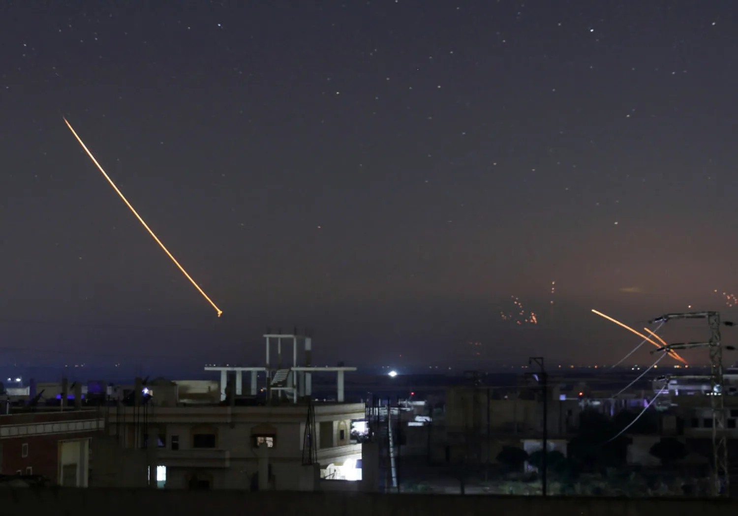 Missile fire is seen over Daraa, Syria, May 10, 2018. (ALAA AL-FAKIR / REUTERS)
