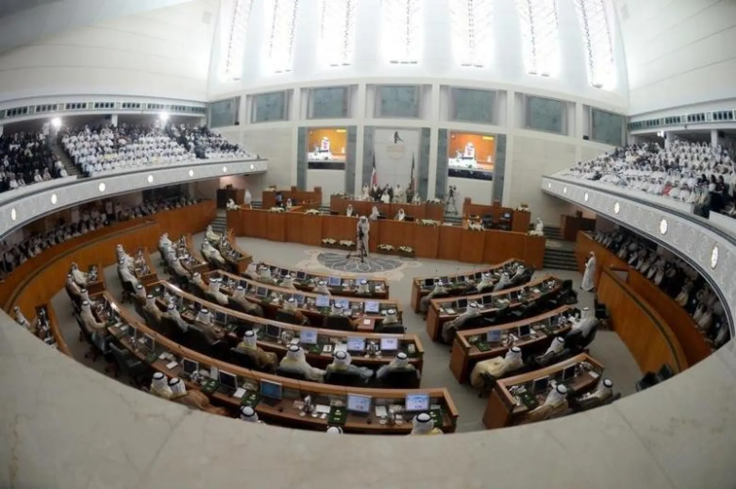 Members of parliament sit in the Parliament pit during the opening session of the fourth year of the 14th Parliament in Kuwait City, Kuwait, October 27, 2015. REUTERS/Stringer