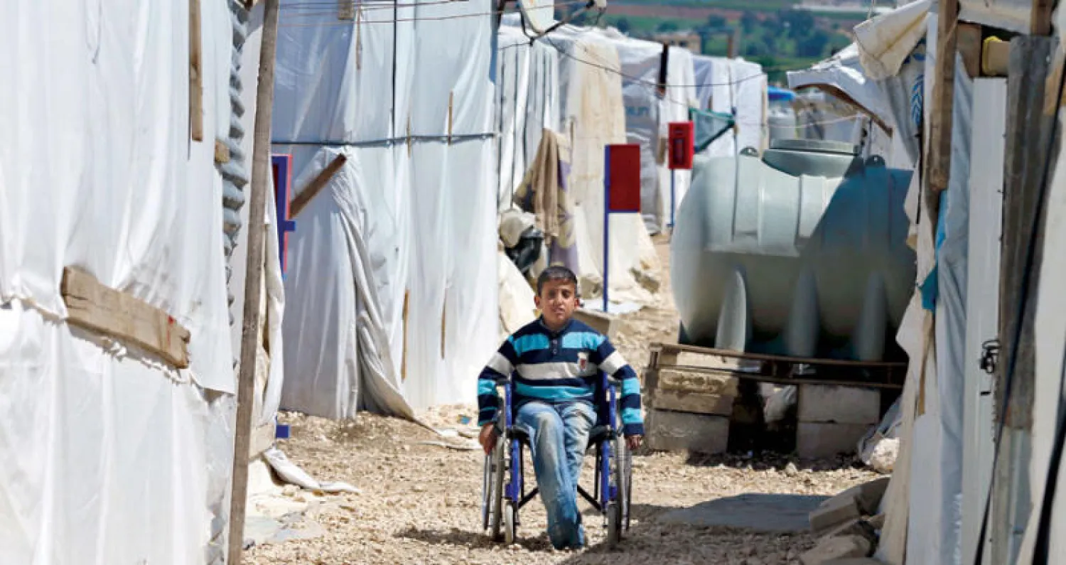 طفل سوري معاق في مخيم ببر الياس بلبنان قرب الحدود السورية في أبريل الماضي (أ.ب)