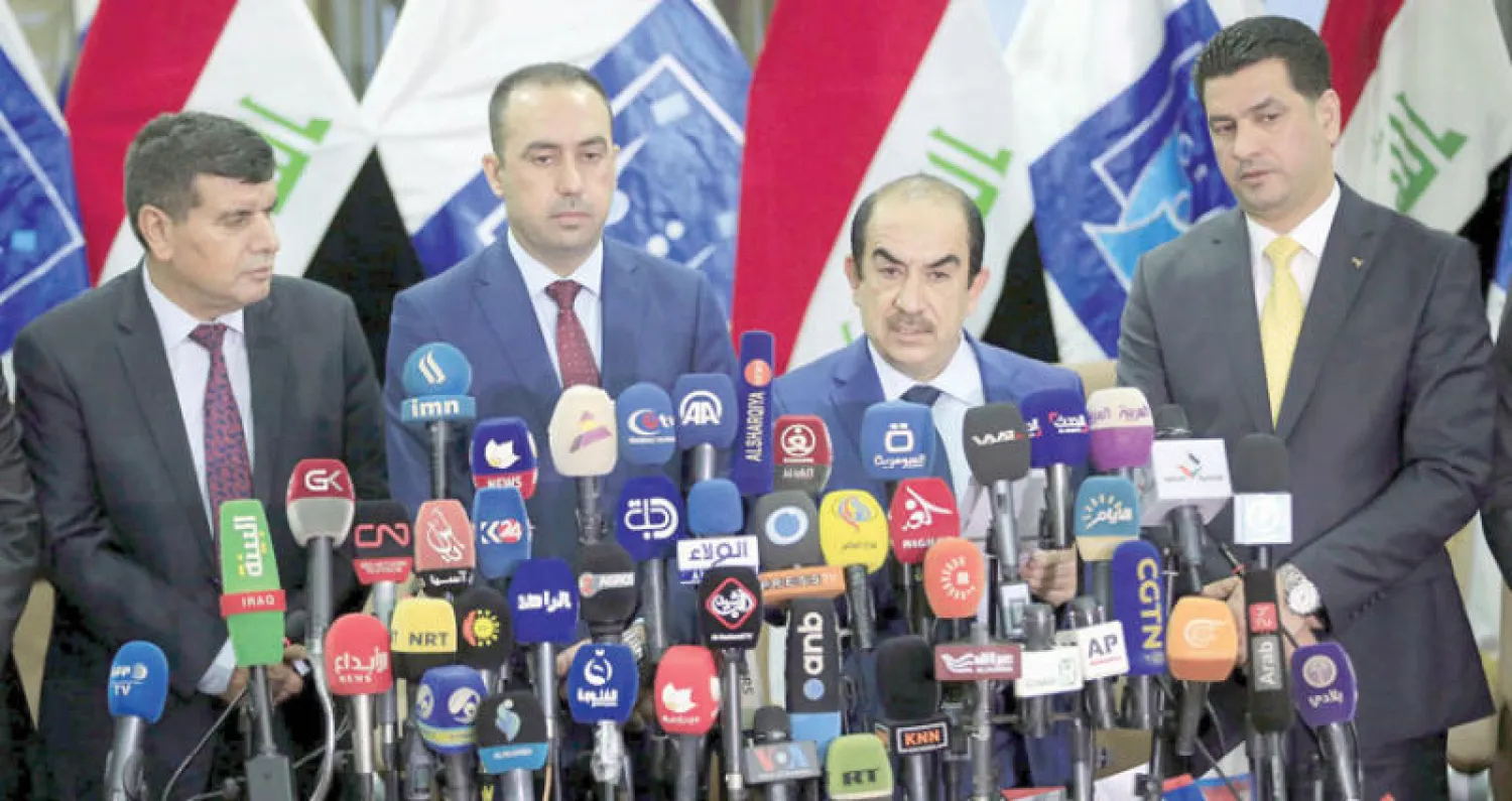رئيس مفوضية الانتخابات العراقية رياض البدران يعلن في مؤتمر صحافي فجر أمس ببغداد نتائج الانتخابات (إ.ب.أ)