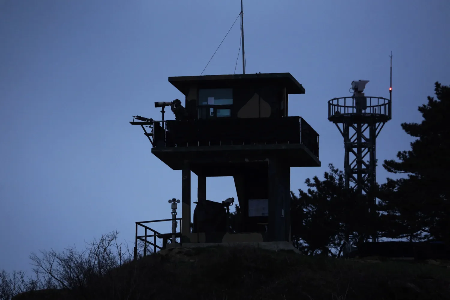 A South Korean soldier looks out to the Yellow Sea from just inside the South Korean side of the Northern Limit Line. (Reuters)