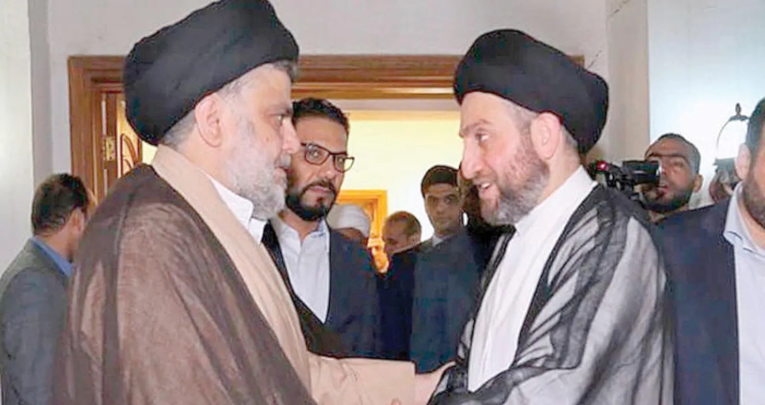 لقاء بين مقتدى الصدر وعمار الحكيم في بغداد أمس (أ.ب)