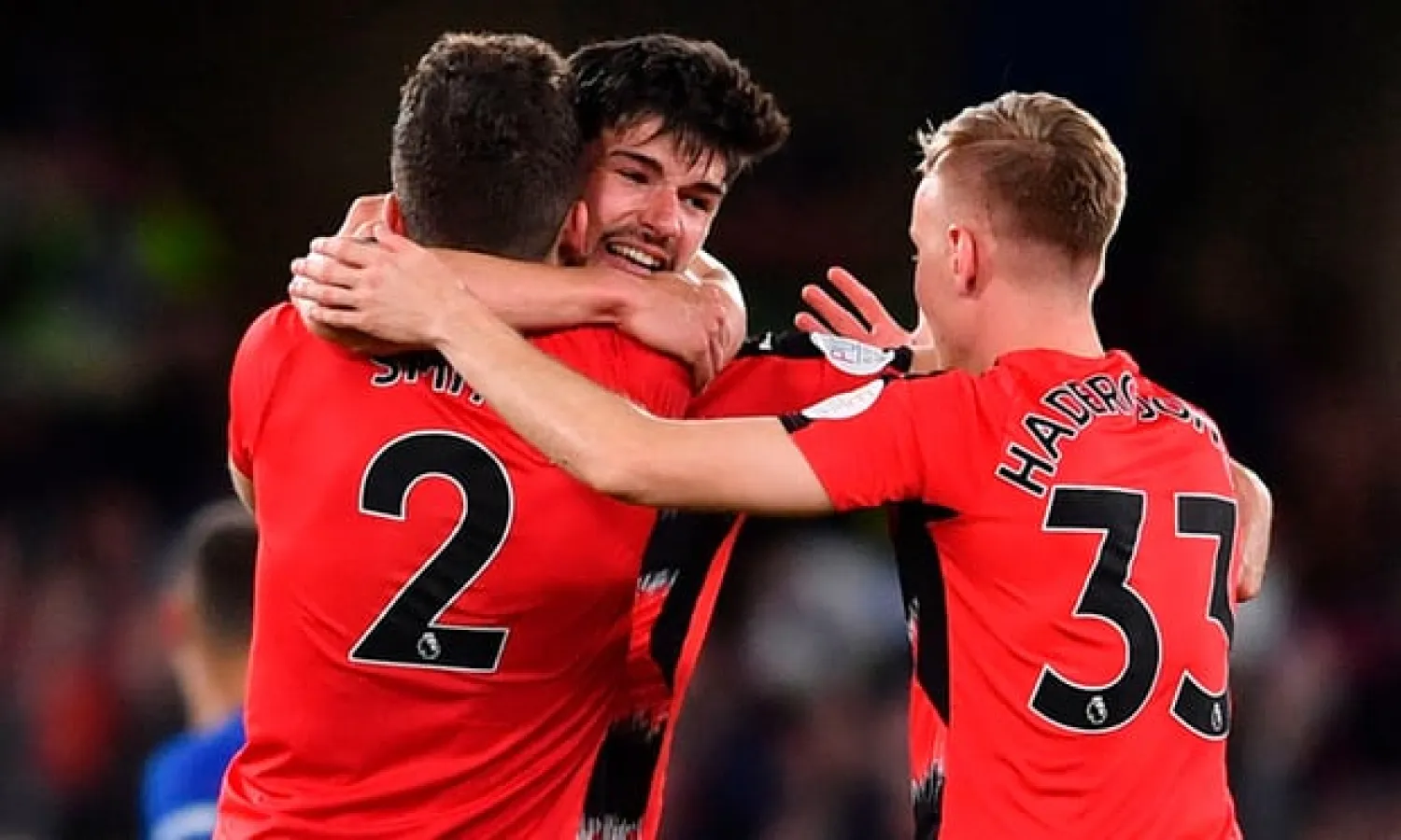  Huddersfield’s Christopher Schindler celebrates with Tommy Smith and Florent Hadergjonaj after the club’s Premier League survival was confirmed with a draw at Chelsea. Photograph: Ben Stansall/AFP/Getty Images
