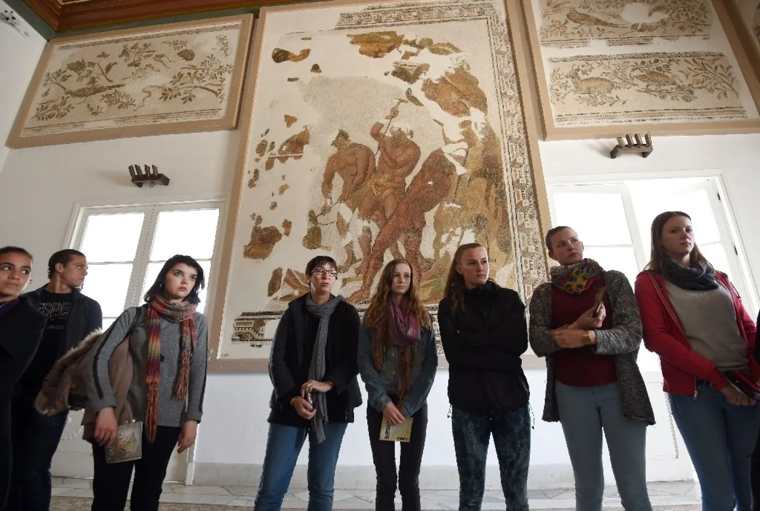 Tourists visit the national Bardo Museum in Tunis during the official re-opening of the tourist site, on March 27, 2015. (AFP)