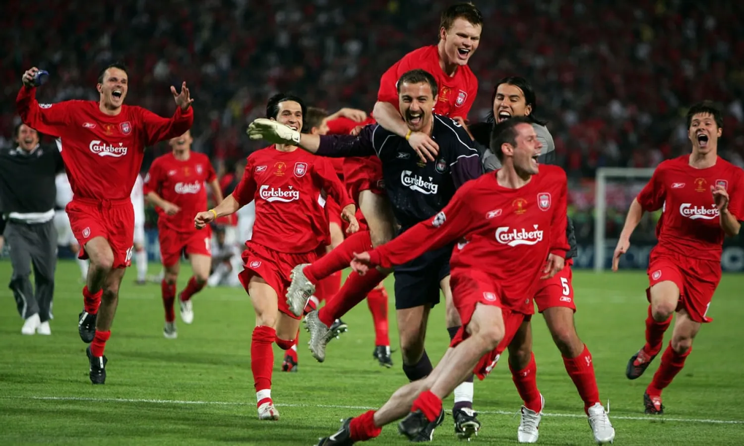 Liverpool’s players mob Jerzy Dudek after beating Milan on penalties to win the 2005 Champions League final. Photograph: Mike Hewitt/Getty Images
