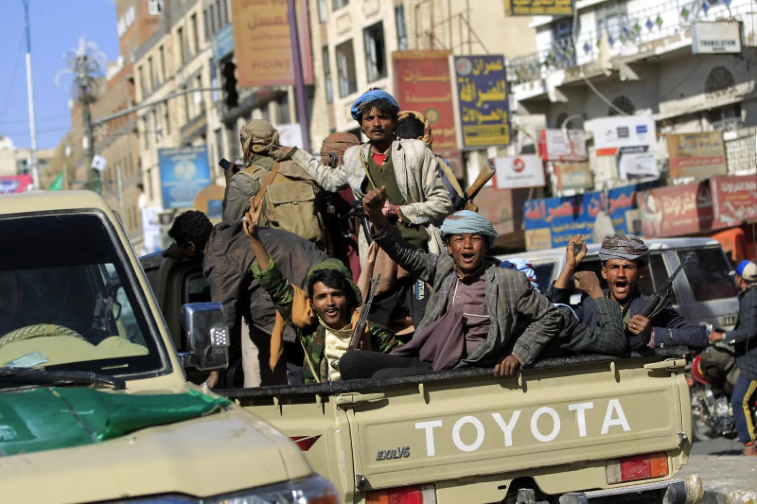 Houthi rebels are seen riding an armored vehicle in Sanaa on Dec. 4, 2017. MOHAMMED HUWAIS/AFP