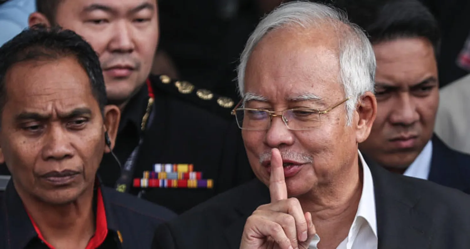 ينفي رئيس الوزراء الماليزي السابق نجيب عبد الرازق وصندوق الاستثمار السيادي أن يكونا ارتكبا أي مخالفات (إ.ب.أ)