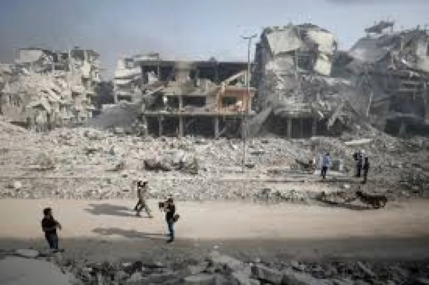 A Syrian army soldier walks past the rubble of damaged buildings in al-Hajar al-Aswad, Syria May 21, 2018. REUTERS/Omar Sanadiki