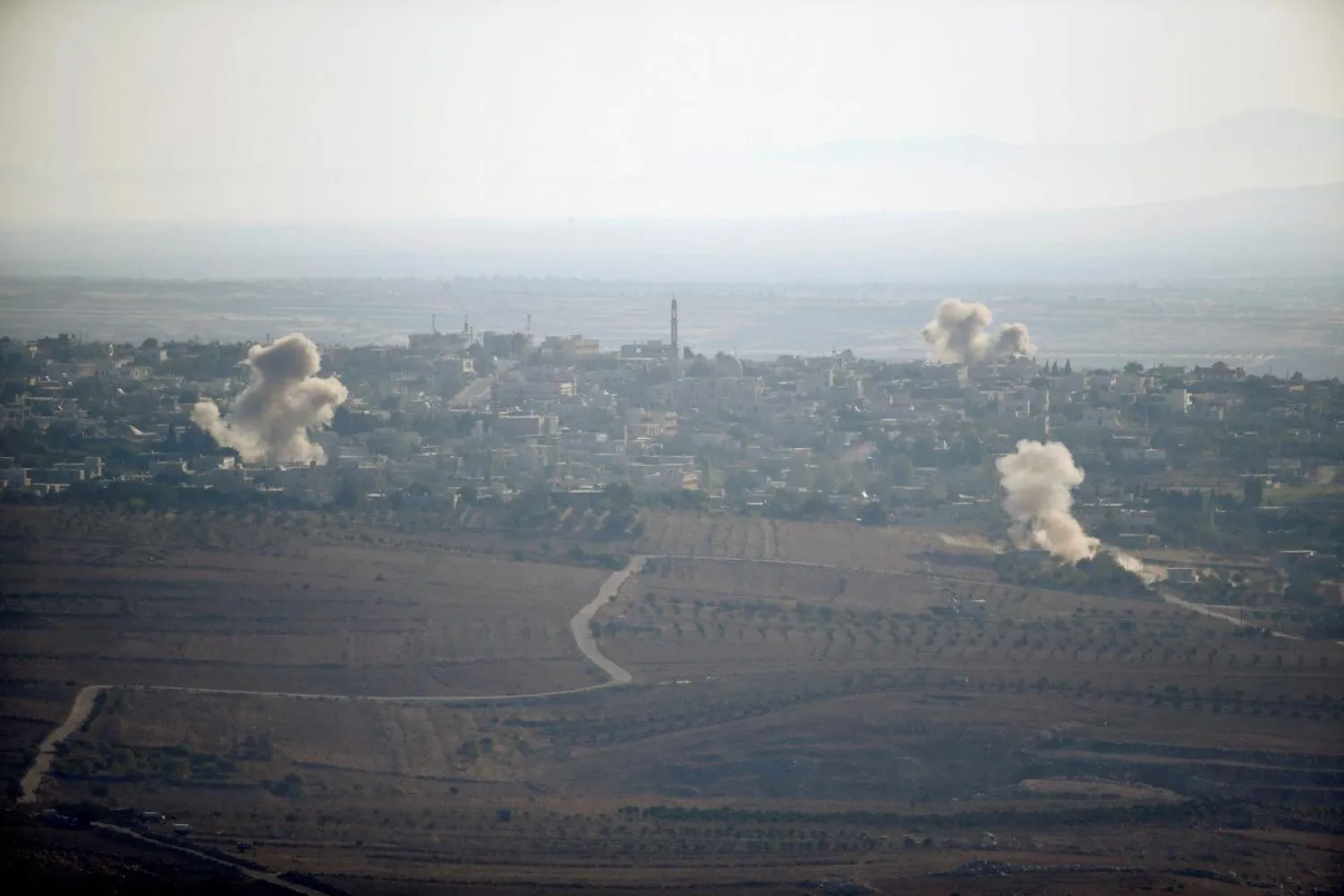 Smoke from explosions from the Israeli side of the border fence between Syria and the Israeli-occupied Golan Heights in September 2016. (Reuters)