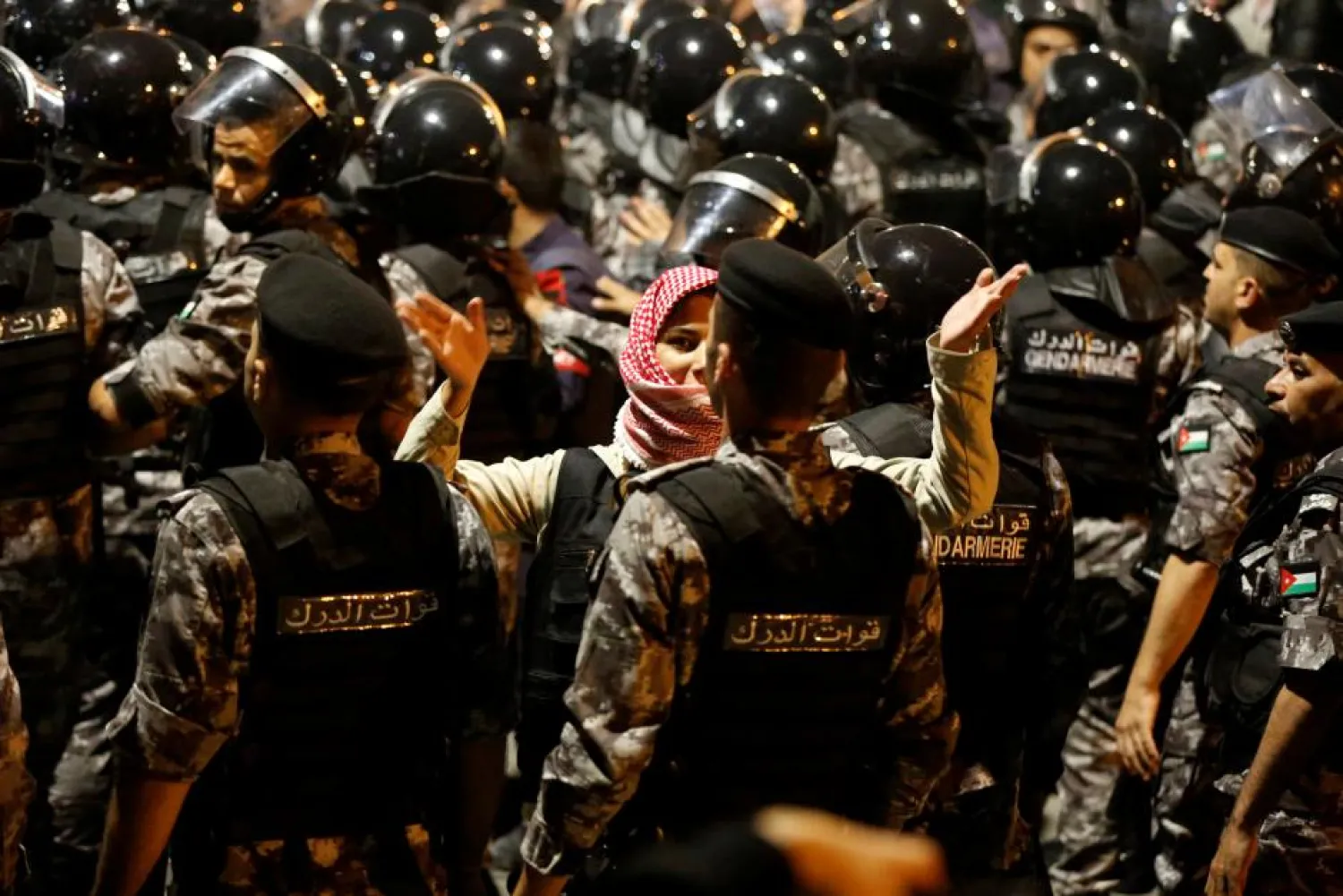 Police officers secure the office of Jordan's prime minister office during a protest in Amman, Jordan, June 2, 2018. (Reuters)