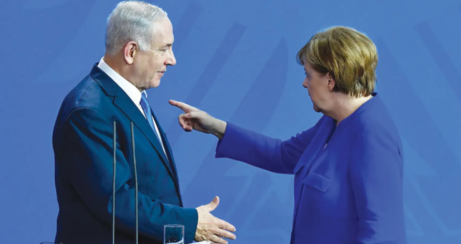  ميركل ونتنياهو فور انتهاء مؤتمرهما الصحافي المشترك في برلين أمس (أ.ف.ب)