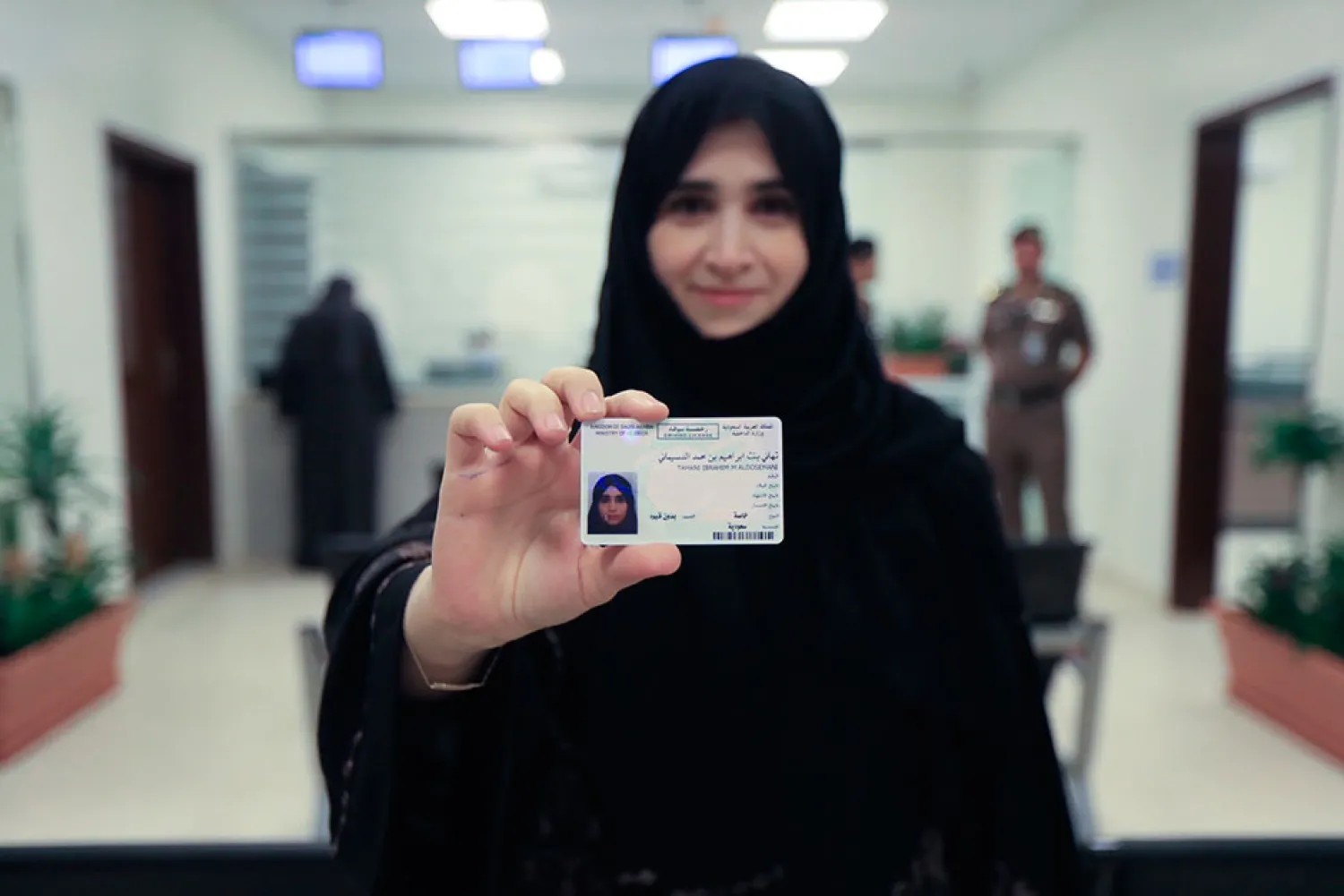 A Saudi women shows her driving license after obtaining it from the General Department of Traffic in the capital, Riyadh. (AP)